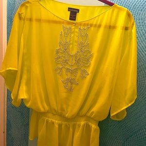 Lady’s yellow top with embroidered decoration from Victoria’s Secret collection.